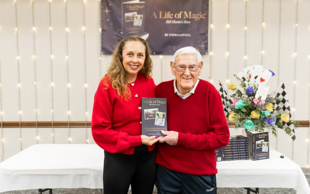   Emma Lovell stands with Roscoe Resident Bill Hunter at the book launch for “A Life of Magic, Bill Hunter’s Story, 102 Years of Service, Showmanship and Unforgettable Storytelling”